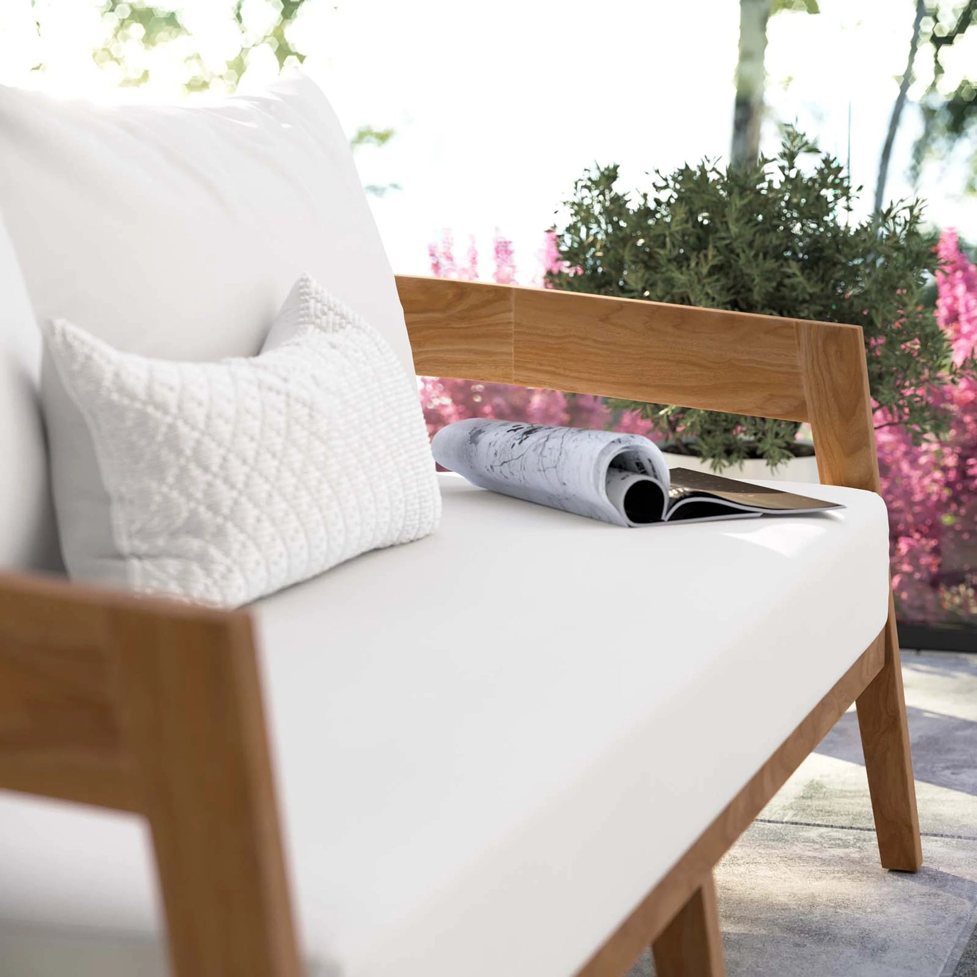 Hazelton Teak Wood Loveseat by Evans & Londeen. Made from teak wood, polyester, mesh sling, plastic tack glides, stainless steel in a modern style.