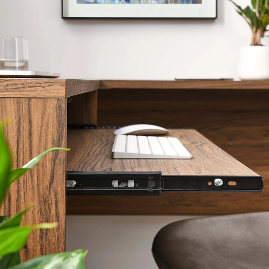 Nicholas L-Shaped Wood Office Desk by Evans & Londeen in walnut. Made from particle board, mdf, engineering wood with straight profile, pp toppan walnut, paper lamination, keyboard tray, tray runner, grommet cover, weight capac