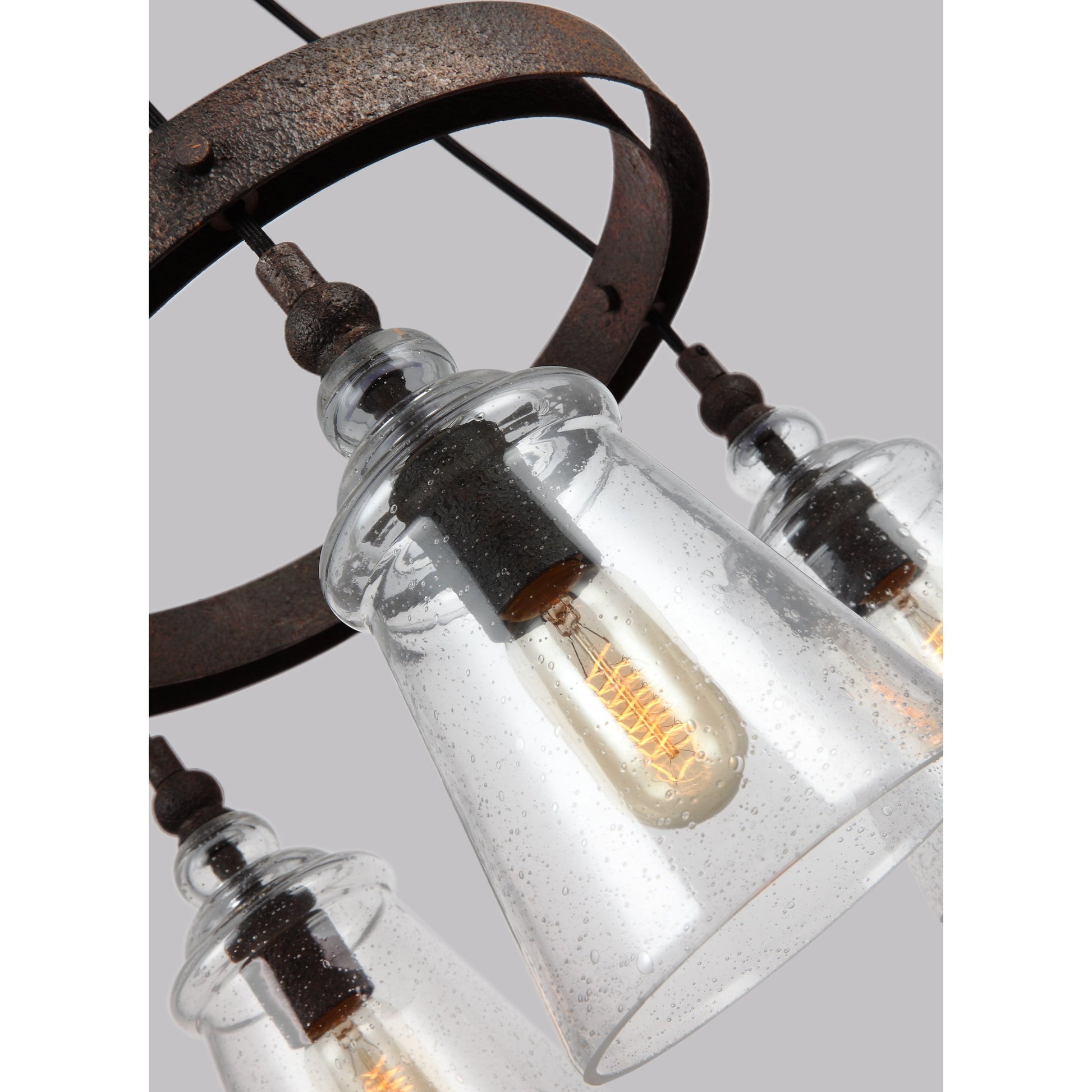 Loras Chandelier by Generation Lighting in dark weathered iron. Made from steel in a modern style.