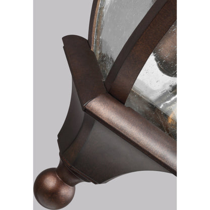 Oakmont Outdoor Wall Lantern by Generation Lighting in patina bronze. Made from cast aluminum in a traditional style.
