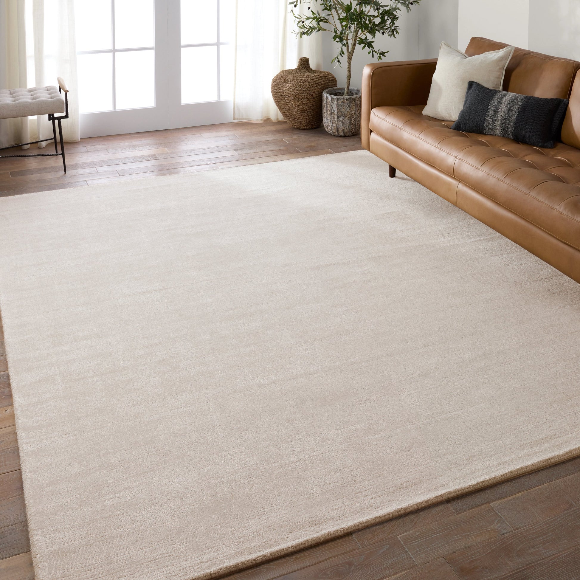 Fletcher FTR01 Rug by Jaipur Living in cream. Made from 100% pet yarn in a unique style.