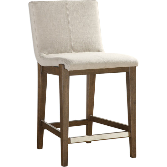 Klemens Linen Counter Stool by Uttermost in neutral linen and walnut. Made from solid wood, plywood, fabric, foam in a cottage & farmhouse style.