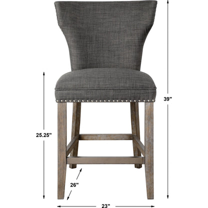 Arnaud Charcoal Counter Stool by Uttermost in charcoal. Made from solid wood, plywood, fabric, foam in a cottage & farmhouse style.