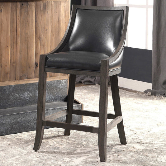 Elowen Counter Stool by Uttermost. Made from solid wood, plywood, pu leather, foam, metal in a transitional style.