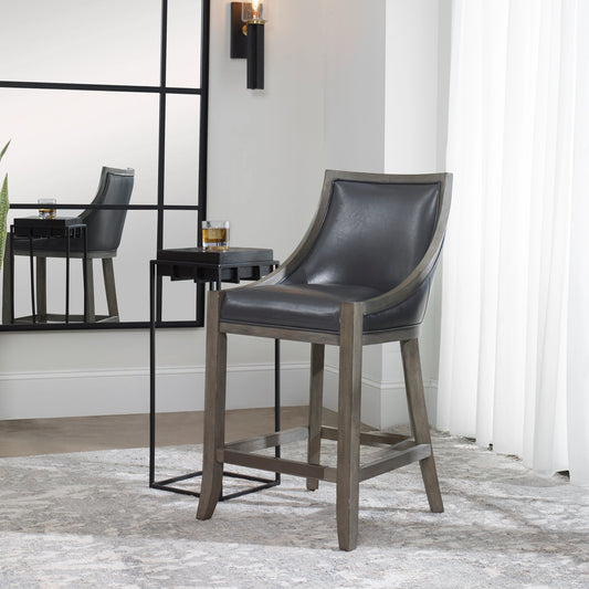 Elowen Counter Stool by Uttermost. Made from solid wood, plywood, pu leather, foam, metal in a transitional style.