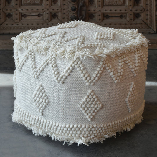 Uriah Ivory Pouf by Uttermost. Made from wool, cotton in a eclectic & global style.