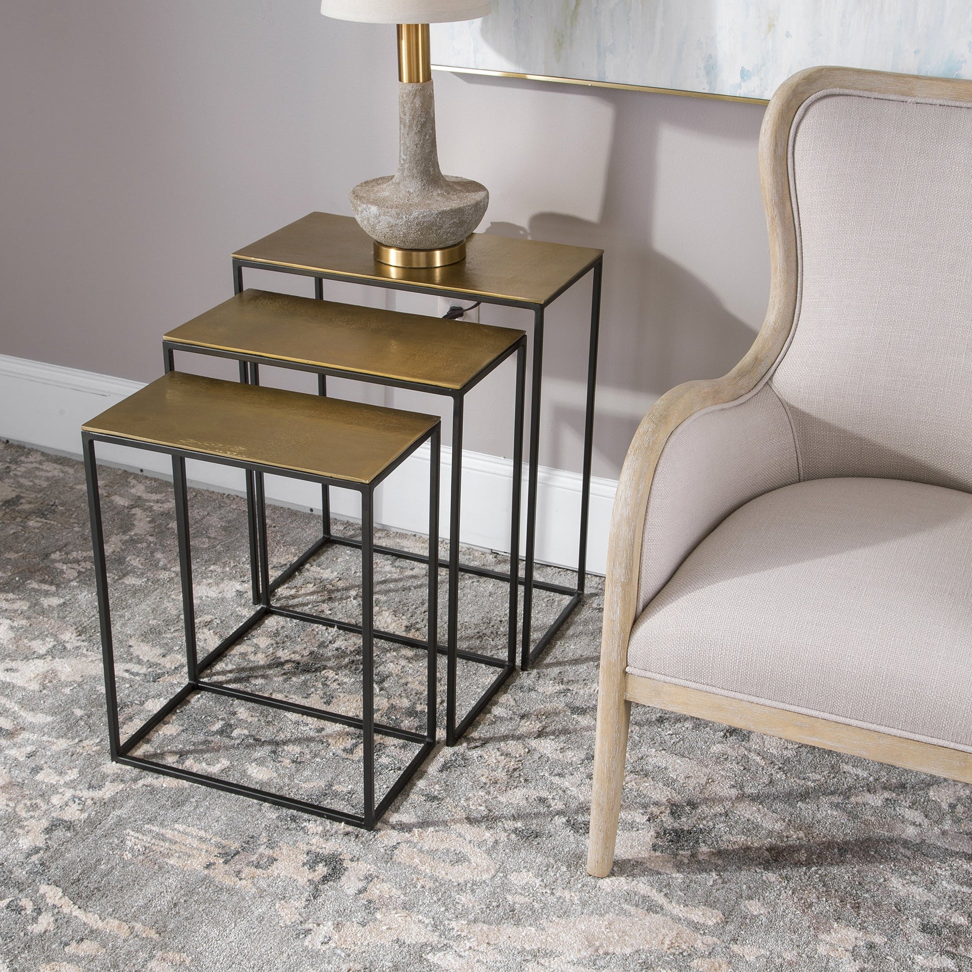 Coreene Nesting Tables by Uttermost in gold. Made from aluminum, iron in a modern style.