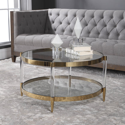 Kellen Coffee Table by Uttermost in gold. Made from stainless steel, glass, acrylic in a transitional style.
