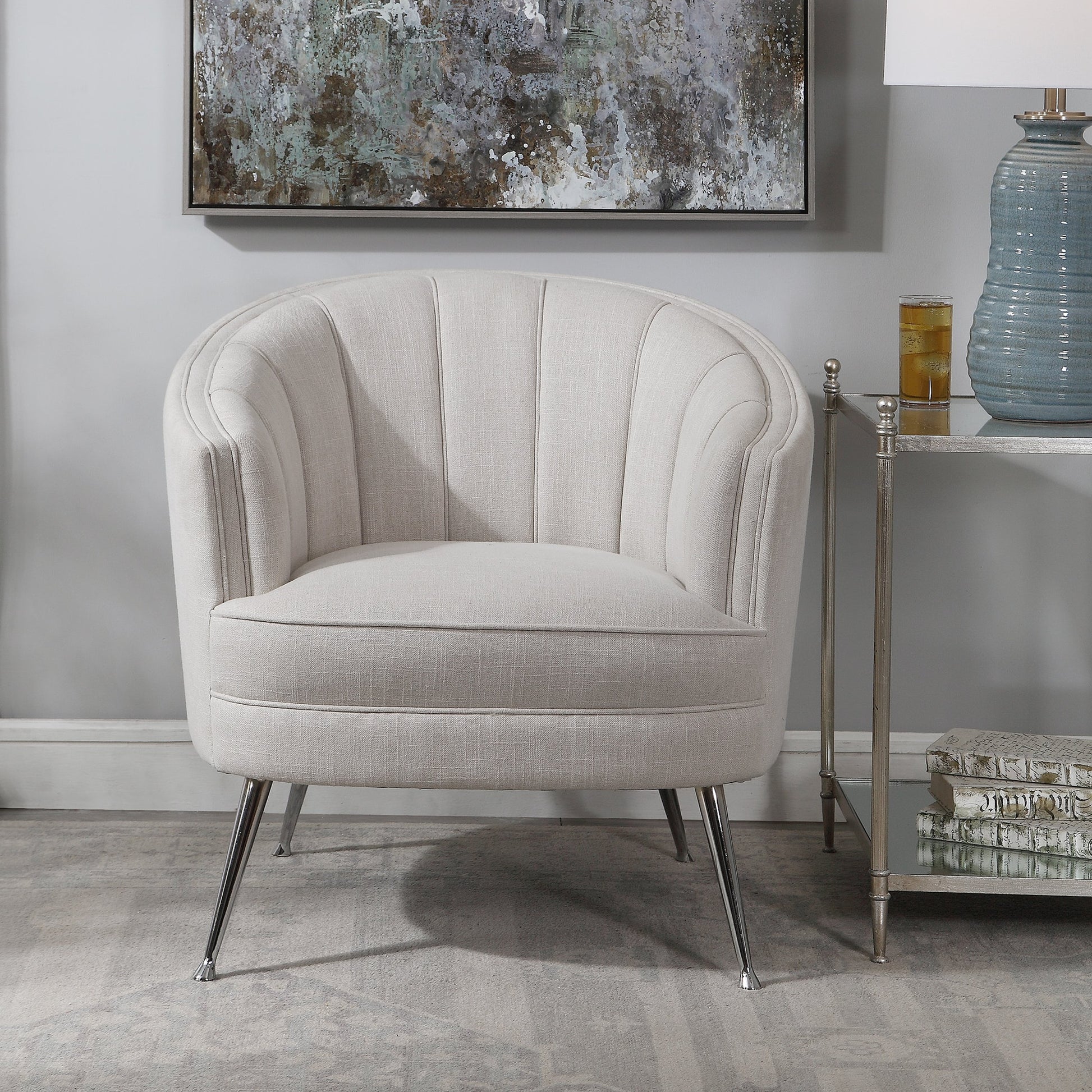 Janie Accent Chair by Uttermost in polished nickel. Made from fabric, plywood, foam, iron in a modern style.