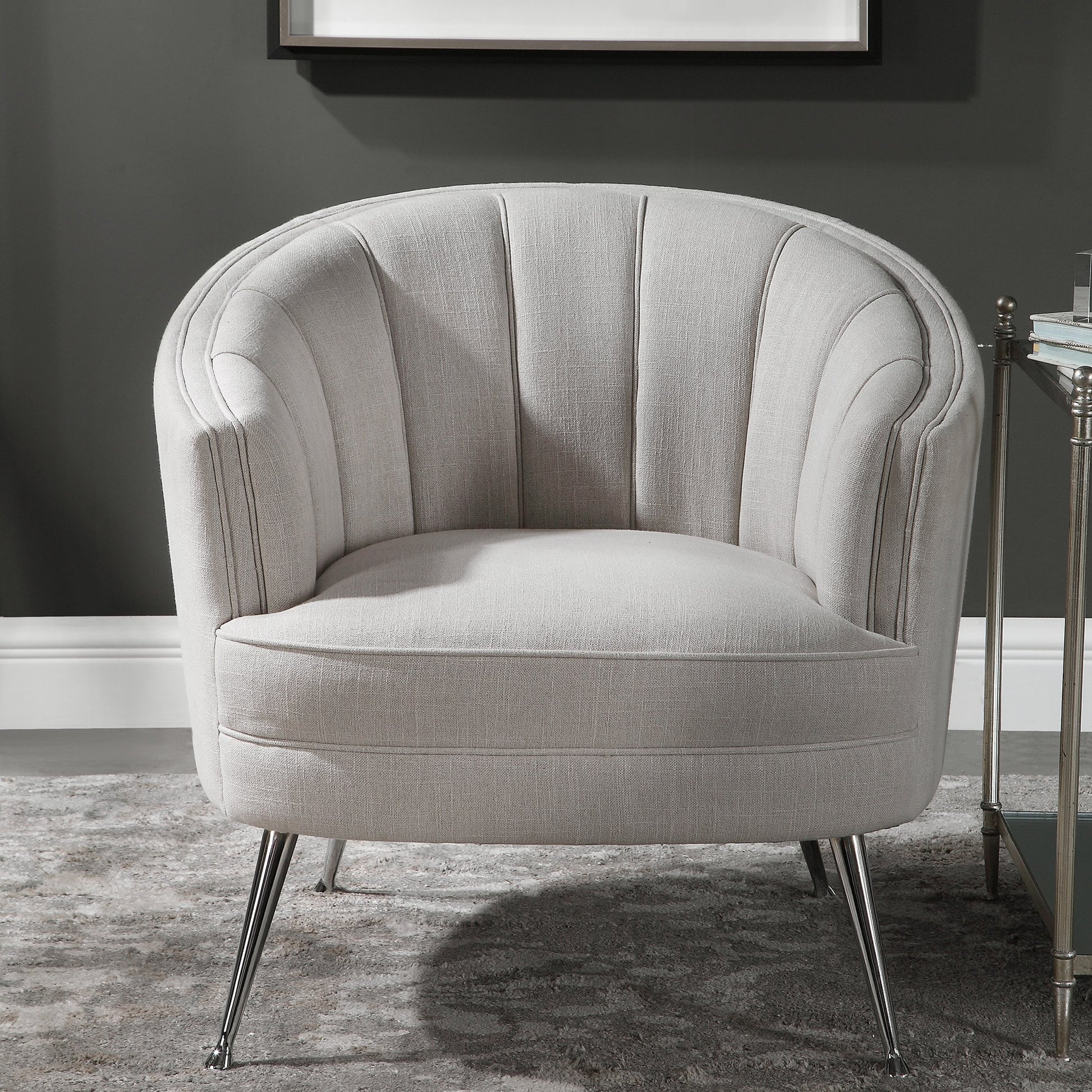 Janie Accent Chair by Uttermost in polished nickel. Made from fabric, plywood, foam, iron in a modern style.