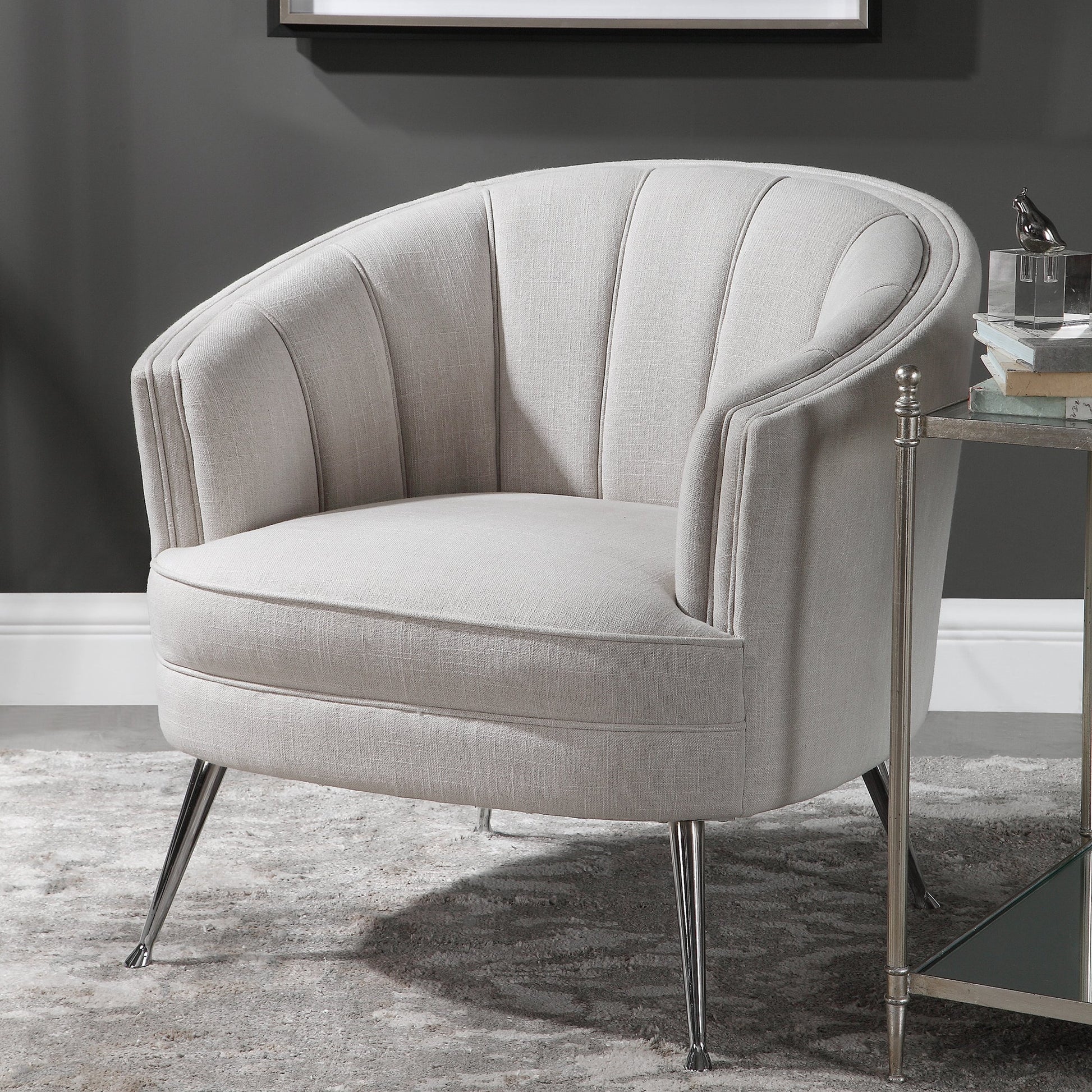 Janie Accent Chair by Uttermost in polished nickel. Made from fabric, plywood, foam, iron in a modern style.