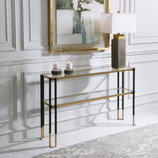 Kentmore Modern Console Table by Uttermost in matte black, brushed gold. Made from iron, glass in a transitional style.
