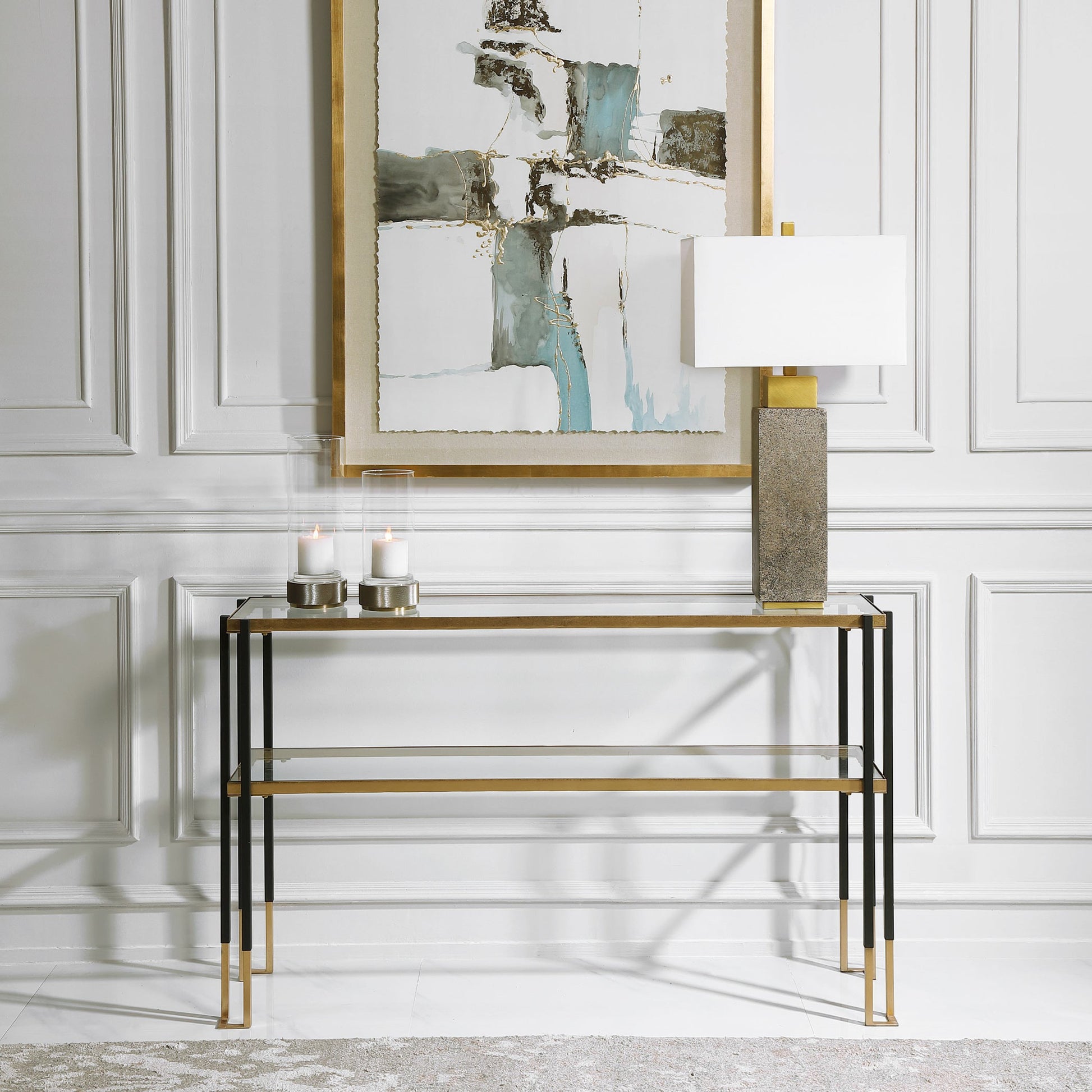 Kentmore Modern Console Table by Uttermost in matte black, brushed gold. Made from iron, glass in a transitional style.