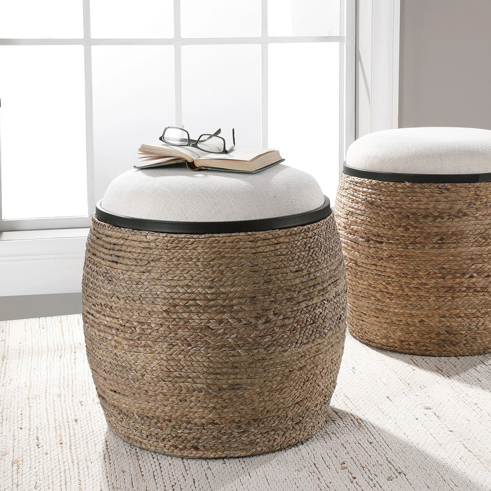 Island Straw Accent Stool by Uttermost. Made from mdf, straw, iron, foam, liene, dacron in a coastal style.