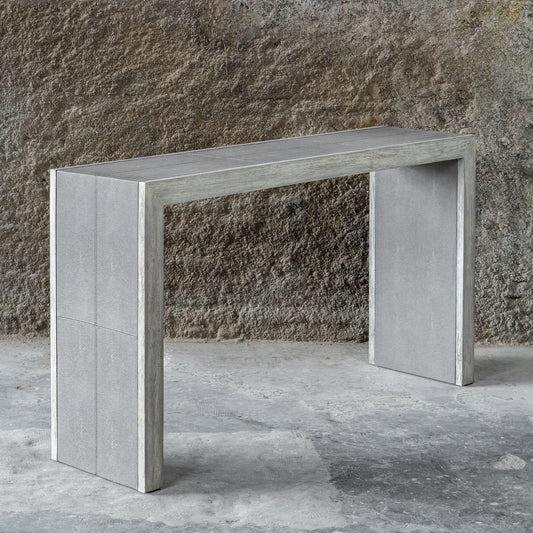 Aerina Console Table by Uttermost in gray. Made from mix wood with tsca title vi, faux shagreen, veneer in a modern style.