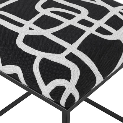 Twists and Turns Accent Stool by Uttermost in matte black. Made from iron, mdf, foam, polyester in a modern style.