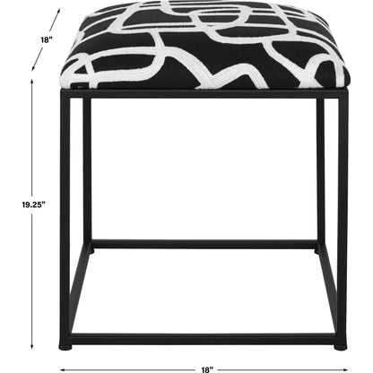 Twists and Turns Accent Stool by Uttermost in matte black. Made from iron, mdf, foam, polyester in a modern style.