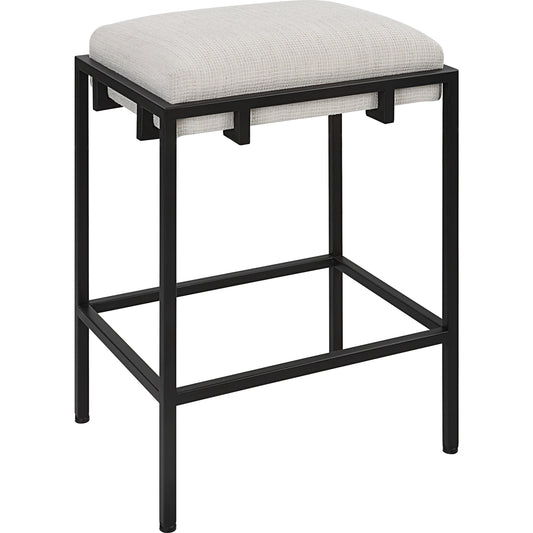 Paradox Counter Stool by Uttermost in matte black. Made from iron, mdf, foam, polyester in a modern style.