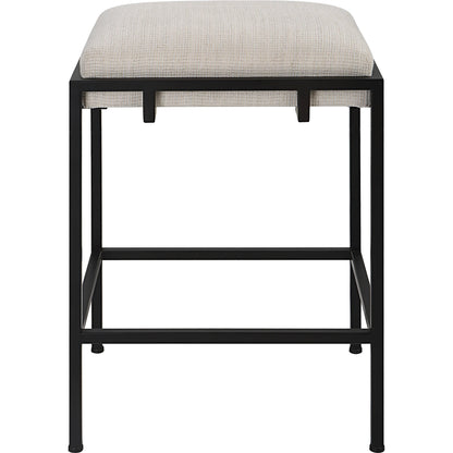 Paradox Counter Stool by Uttermost in matte black. Made from iron, mdf, foam, polyester in a modern style.