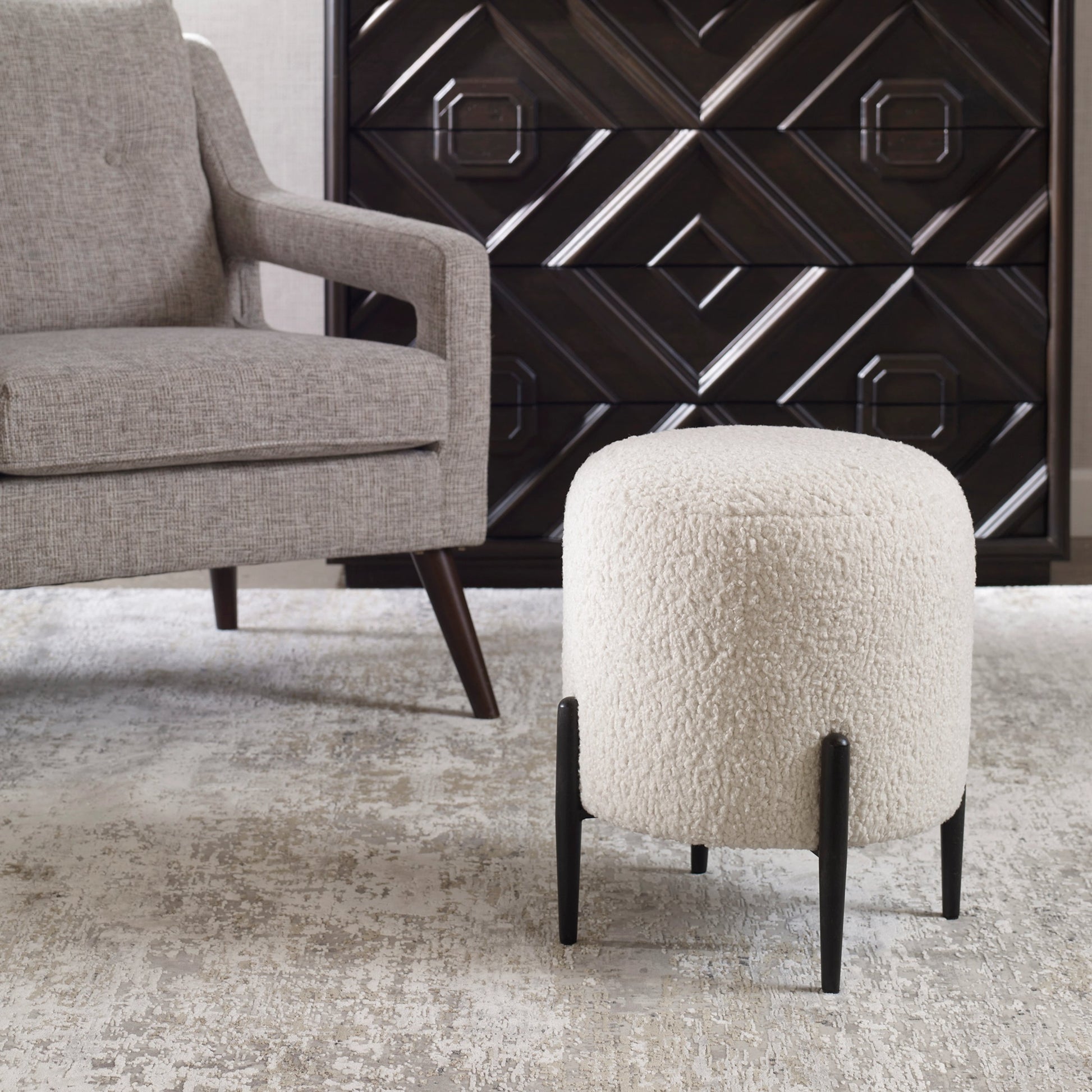 Arles Ottoman by Uttermost in white and satin black. Made from hardwood, plywood, fabric, foam in a transitional style.