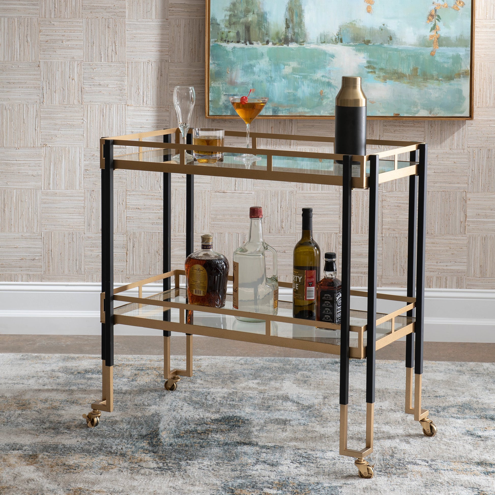 Kentmore Bar Cart by Uttermost in matte black, brushed gold. Made from iron, tempered glass in a modern style.