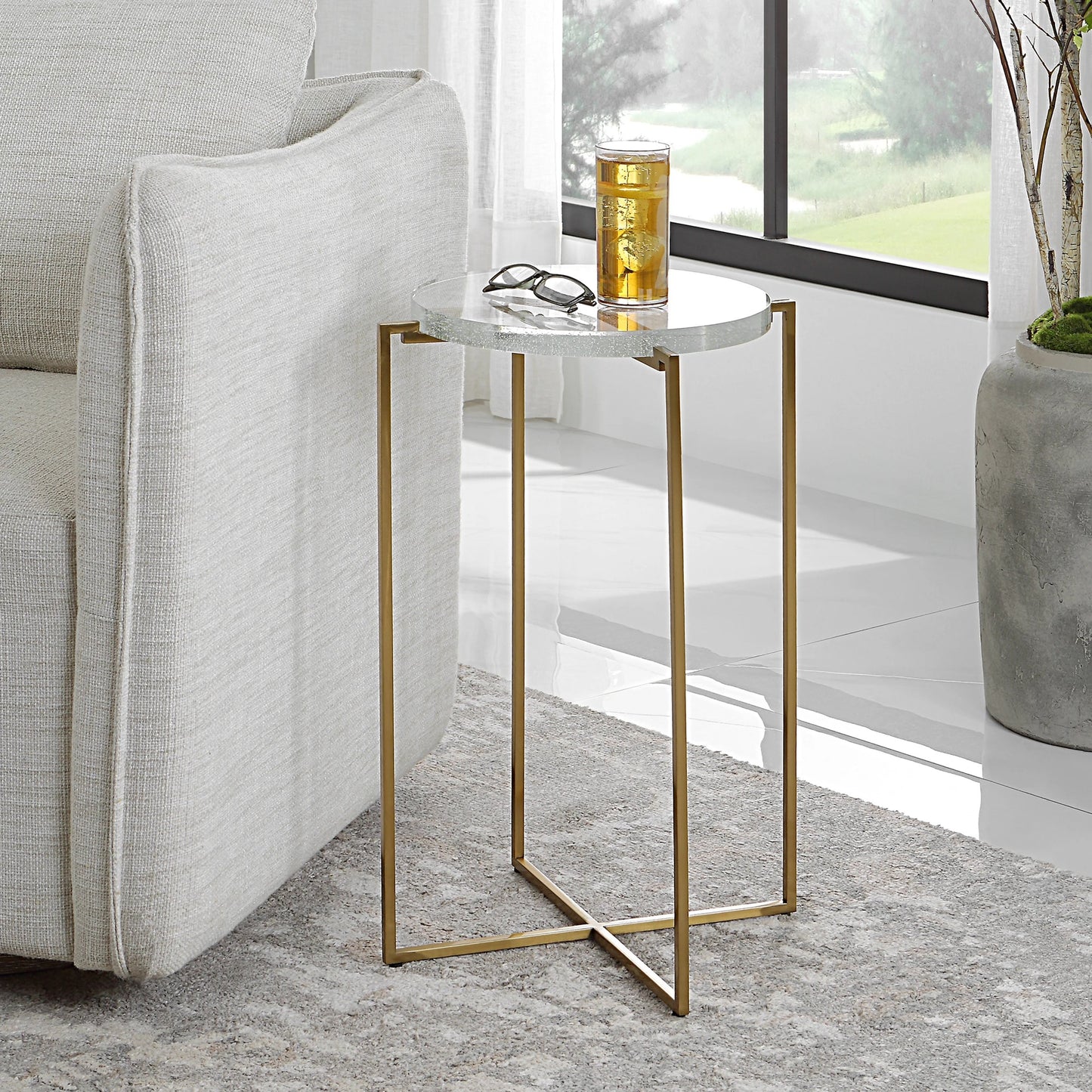 004 SI-1923725 | Lifestyle | Star-Crossed Accent Table by Uttermost in gold. Made from seeded thick glass, stainless steel in a modern style.