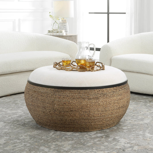 Island Ottoman by Uttermost. Made from mdf, straw, iron, fir, foam, linen, dacron in a coastal style.