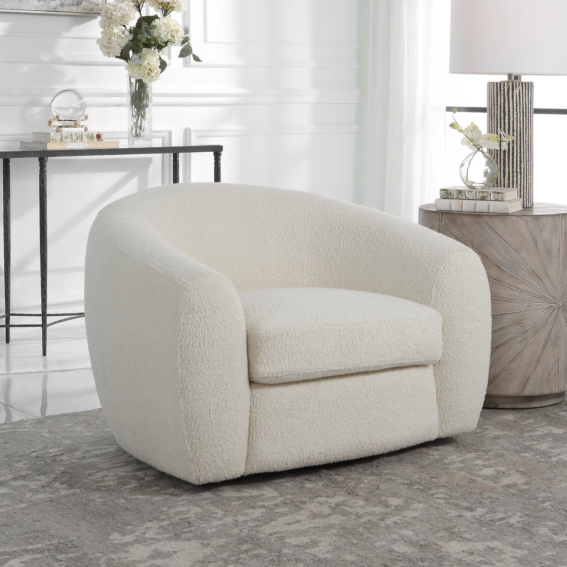 Capra Swivel Chair by Uttermost in multi. Made from fabric, foam, plywood, stainless steel in a modern style.