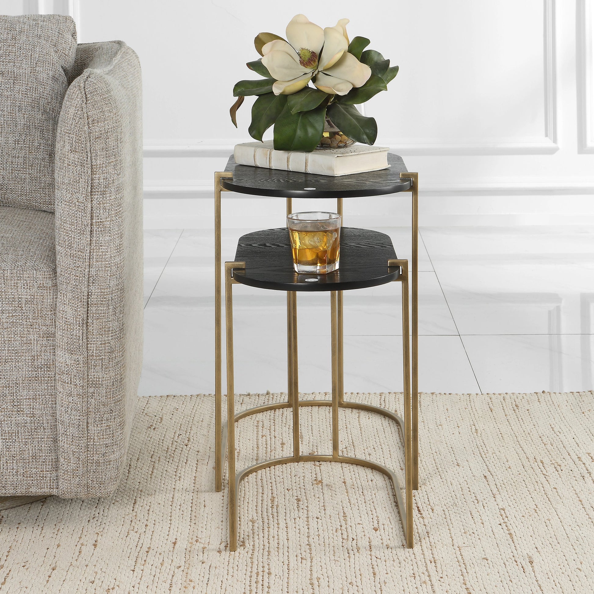 Aztec Nesting Tables by Uttermost in antique brass, ebony. Made from iron, mdf, ash in a modern style.