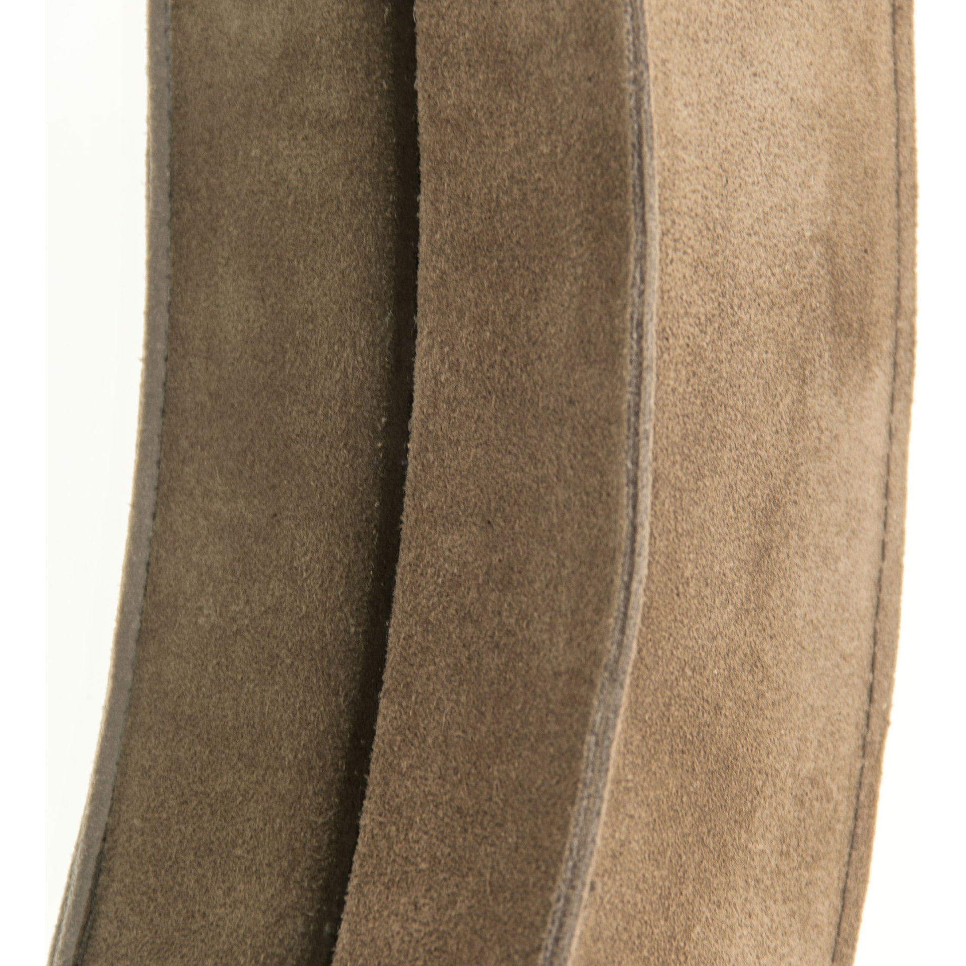 Pendre Mirror by Zentique in tan suede leather and suede, glass. Made from suede, glass in a rustic style.