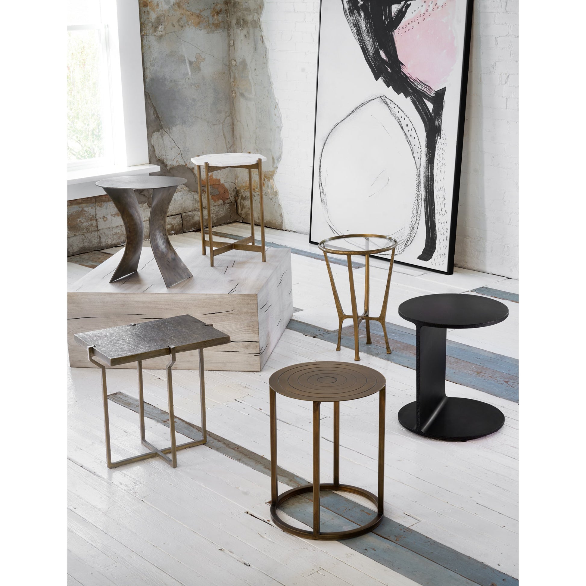 Creighton End Table by Four Hands in aged brass. Made from aluminum, tempered glass in a modern style.