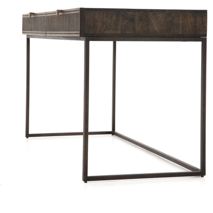Kelby Writing Desk by Four Hands in aged brass, carved vintage brown, vintage brown, gunmetal and vintage brown. Made from solid mango, iron in a modern style.