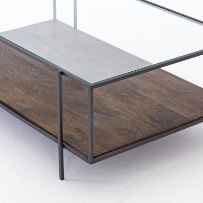 Byron Coffee Table by Four Hands in gunmetal, aged brown, tempered glass and dark iron, aged brown, tempered glass. Made from iron, solid mango, tempered glass in a modern style.