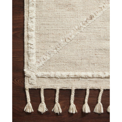 IMA-05 by Loloi in beige, ivory. Made from 100% wool in a eclectic & global style.
