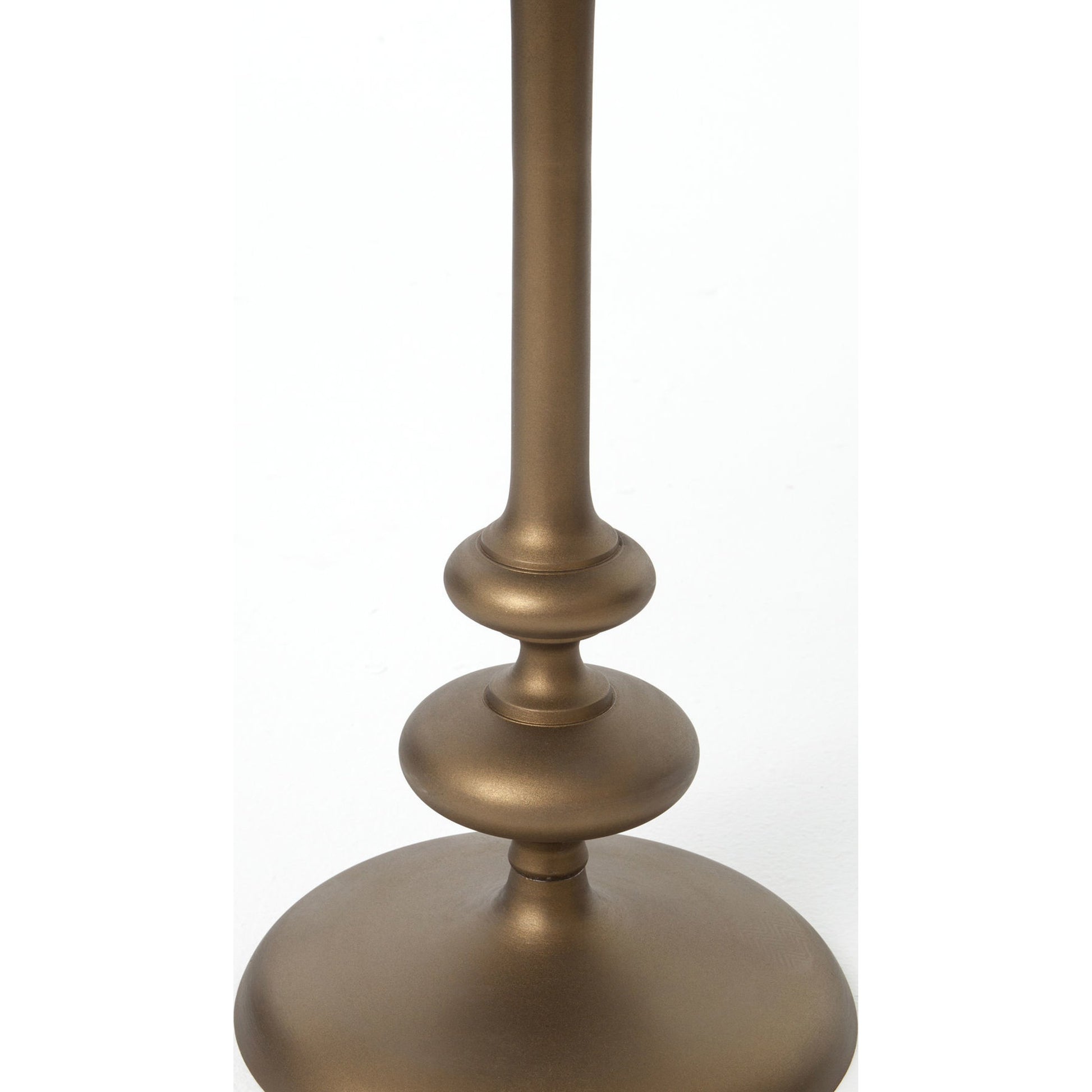 Marlow Matchstick Pedestal Table by Four Hands in matte brass. Made from aluminum in a modern style.