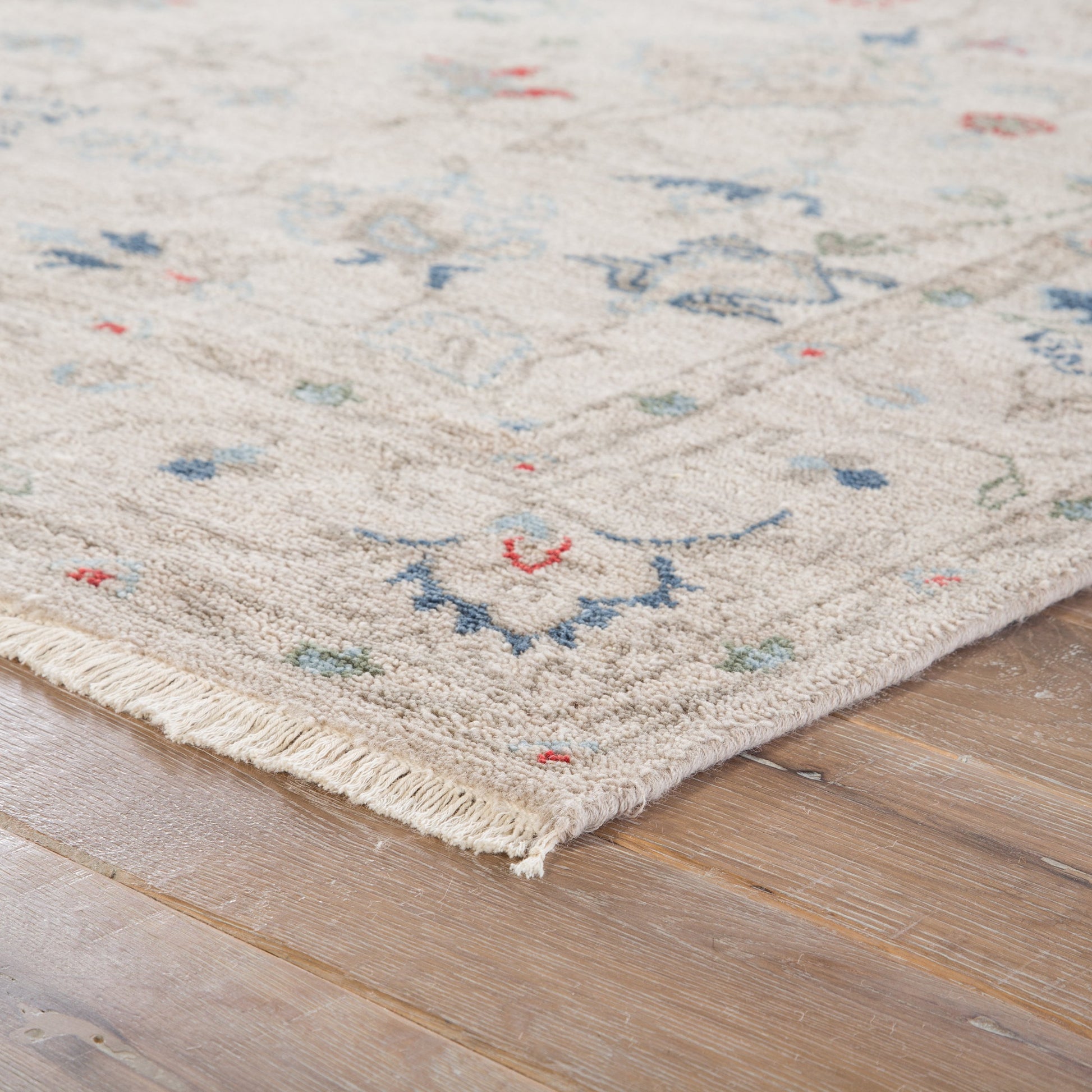 Hacci Rug by Jaipur Living in cream, blue. Made from 100% wool in a unique style.