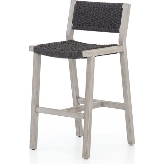 Delano Outdoor Bar Stool by Four Hands. Made from solid fsc®-certified teak, 100% polypropylene in a coastal style.