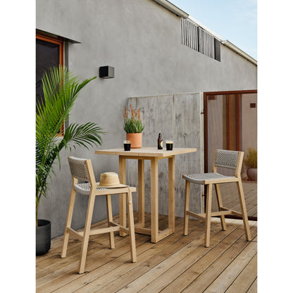 Delano Outdoor Bar Stool by Four Hands. Made from solid fsc®-certified teak, 100% polypropylene in a coastal style.
