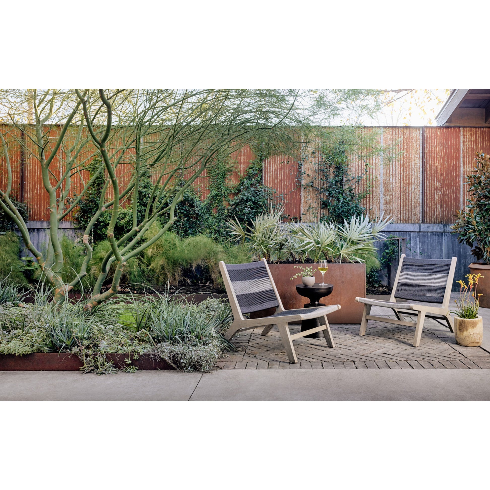 Julian Outdoor Chair by Four Hands. Made from 100% olefin, solid fsc®-certified teak, 100% polypropylene in a modern style.