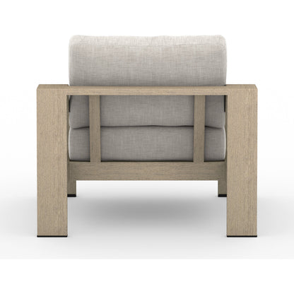 Monterey Outdoor Chair by Four Hands in stone gray, washed brown. Made from 100% olefin, solid fsc®-certified teak, 59% polyurethane foam, 30% polyester fiber, 11% polyester fiber batting in a coastal style.