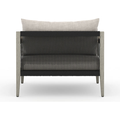 Sherwood Outdoor Chair, Weathered Grey by Four Hands. Made from 100% olefin, solid fsc®-certified teak, 100% polypropylene in a coastal style.