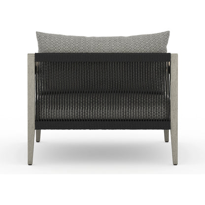 Sherwood Outdoor Chair, Weathered Grey by Four Hands. Made from 100% olefin, solid fsc®-certified teak, 100% polypropylene in a coastal style.