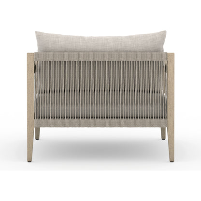 Sherwood Outdoor Chair, Washed Brown by Four Hands. Made from 100% olefin, solid fsc®-certified teak, 100% polypropylene in a coastal style.