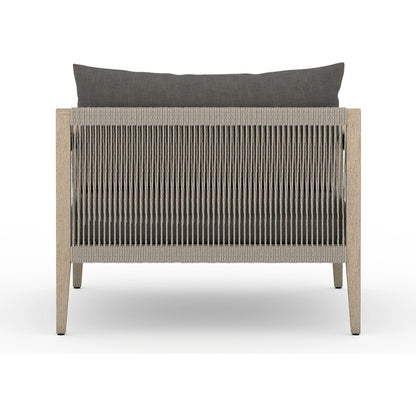 Sherwood Outdoor Chair, Washed Brown by Four Hands. Made from 100% olefin, solid fsc®-certified teak, 100% polypropylene in a coastal style.