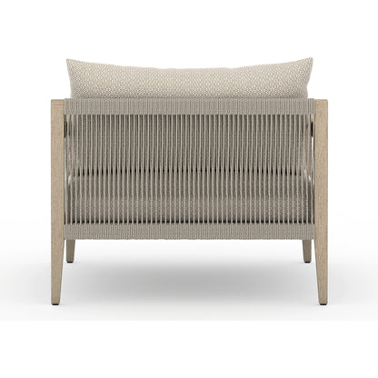 Sherwood Outdoor Chair, Washed Brown by Four Hands. Made from 100% olefin, solid fsc®-certified teak, 100% polypropylene in a coastal style.