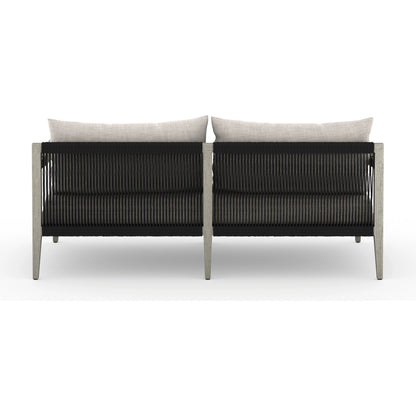 Sherwood Outdoor Sofa, Weathered Grey by Four Hands. Made from 100% olefin, solid fsc®-certified teak, 100% polypropylene in a coastal style.