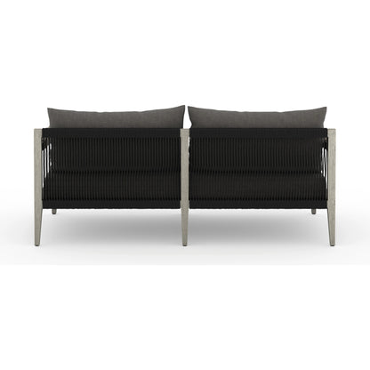 Sherwood Outdoor Sofa, Weathered Grey by Four Hands. Made from 100% olefin, solid fsc®-certified teak, 100% polypropylene in a coastal style.