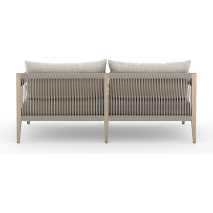 Sherwood Outdoor Sofa, Washed Brown by Four Hands. Made from 100% olefin, solid fsc®-certified teak, 100% polypropylene in a coastal style.