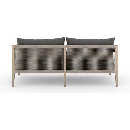 Sherwood Outdoor Sofa, Washed Brown by Four Hands. Made from 100% olefin, solid fsc®-certified teak, 100% polypropylene in a coastal style.
