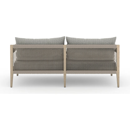 Sherwood Outdoor Sofa, Washed Brown by Four Hands. Made from 100% olefin, solid fsc®-certified teak, 100% polypropylene in a coastal style.